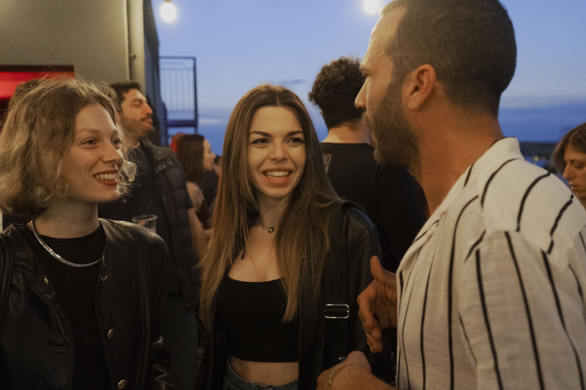 Dubel Team event — guests mingling at rooftop gathering
