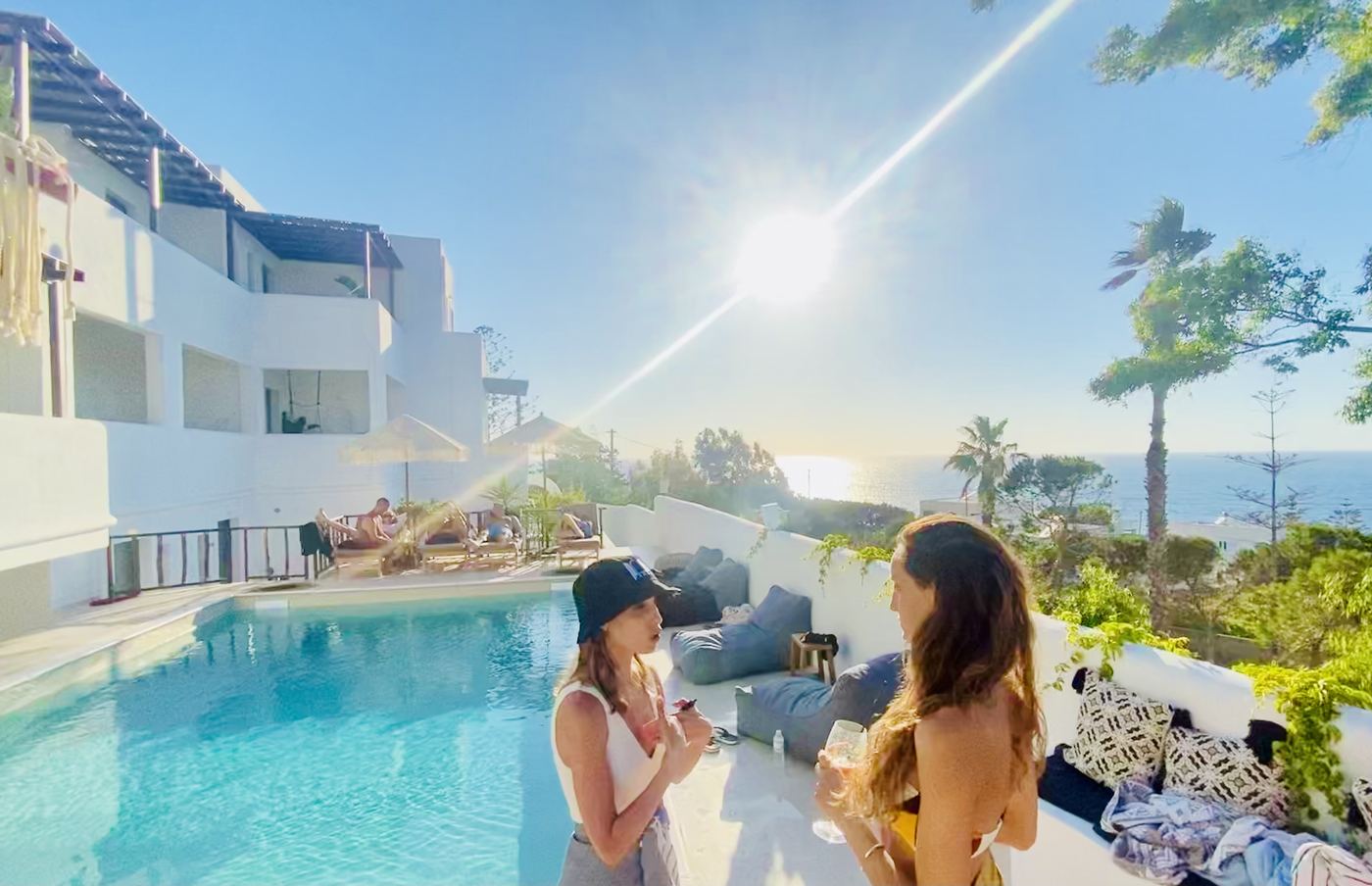 Greek hospitality programming — poolside event with sea view