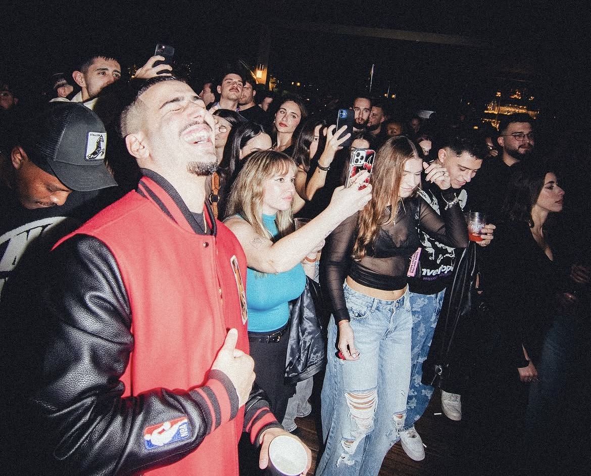 Hotel rooftop crowd — energy and laughter